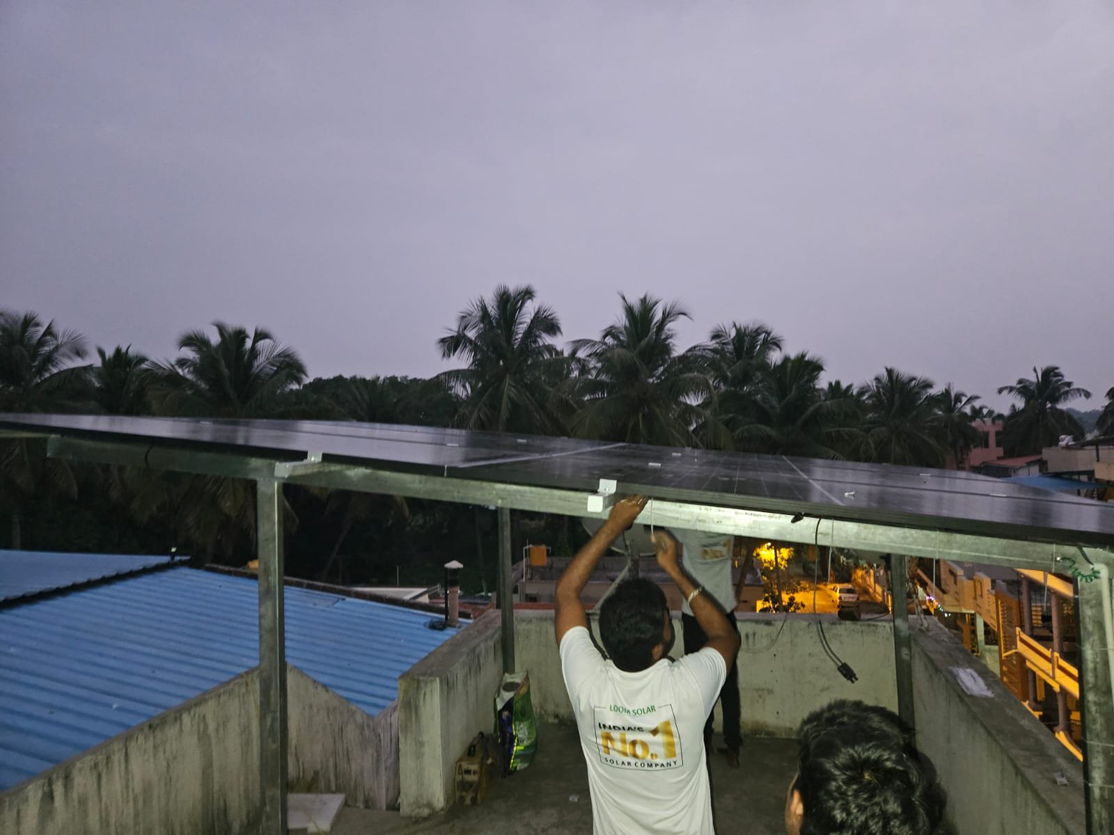 Technicians connecting solar panels to the power system